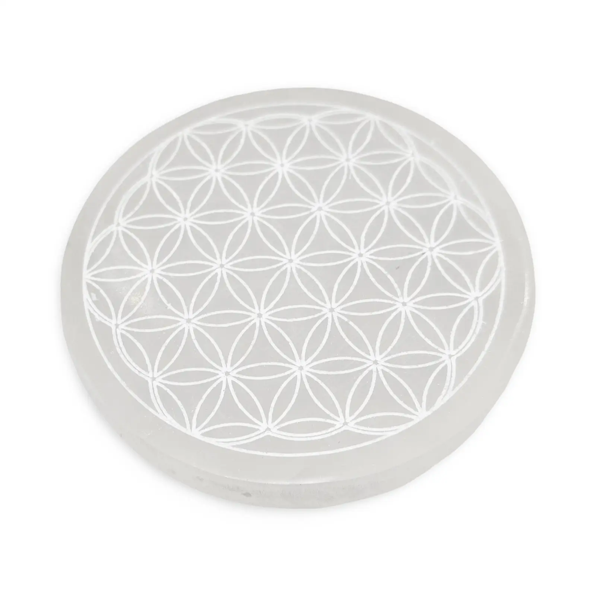 Round white selenite charging plate with Flower of Life pattern.