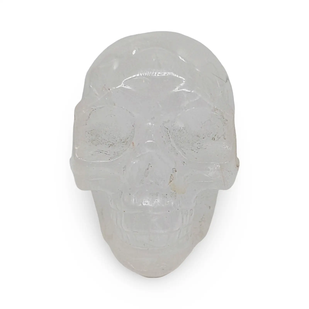 Skull sculpture carved from clear quartz, 3.5 in tall, by Pür Sérénité