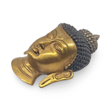 Buddha head wall decor sculpture in gold metallic finish with textured black hair and antique patina.
