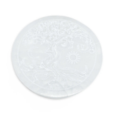 Selenite charging plate by Pür Sérénité featuring a tree of life with moon and sun
