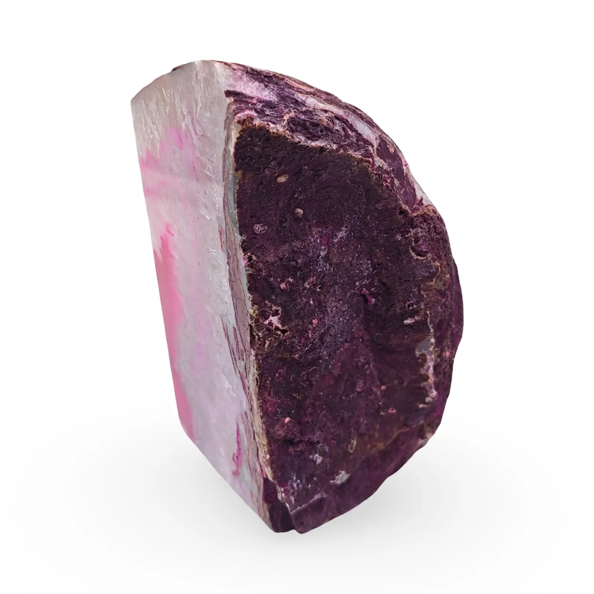 Stone geode pink agate sculpture by Pür Sérénité; natural pink exterior with dark purple interior.